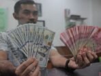 antarafoto-respons-positif-kenaikan-bi-rate-dolar-as-rupiah-250424-rn-8